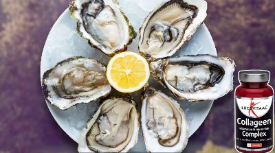 Een bord oesters met een halve citroen in het midden
